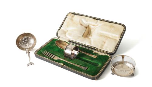 A SCOTTISH SILVER TEA STRAINER AND STAND, A PART CHRISTENING SET AND A SILVER TEA STRAINER (4)