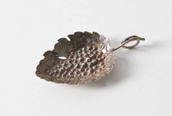 A GEORGE III SILVER CADDY SPOON