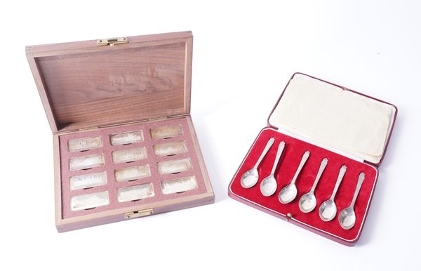 A SET OF 12 SILVER INGOTS AND A SET OF SIX SILVER TEASPOONS (2)