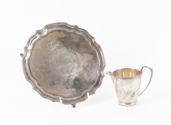 A SILVER SALVER AND A SILVER MILK JUG (2)