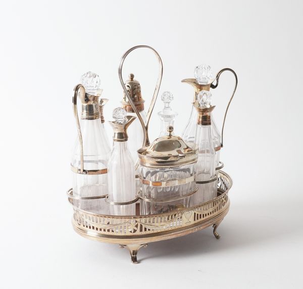 A SILVER MOUNTED EIGHT BOTTLE CRUET SET