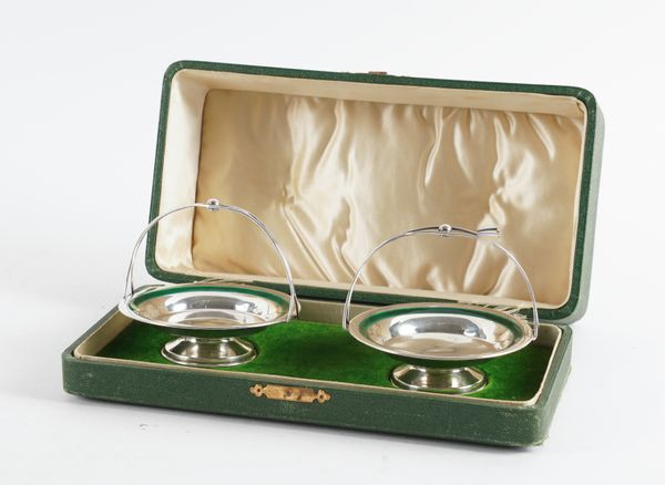 A PAIR OF SILVER AND GREEN ENAMELLED BONBON DISHES