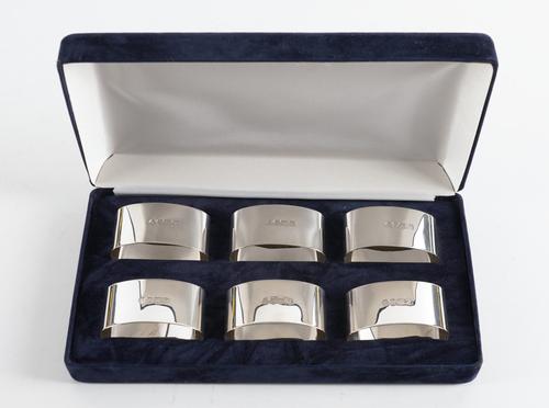 A SET OF SIX SILVER NAPKIN RINGS