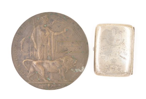 A FIRST WORLD WAR BRONZE MEMORIAL PLAQUE AND A SILVER CIGARETTE CASE (2)