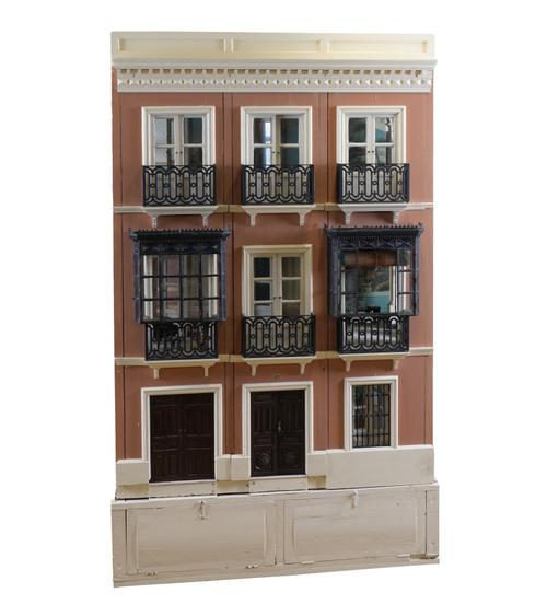 A LARGE PAINTED DOLLS HOUSE