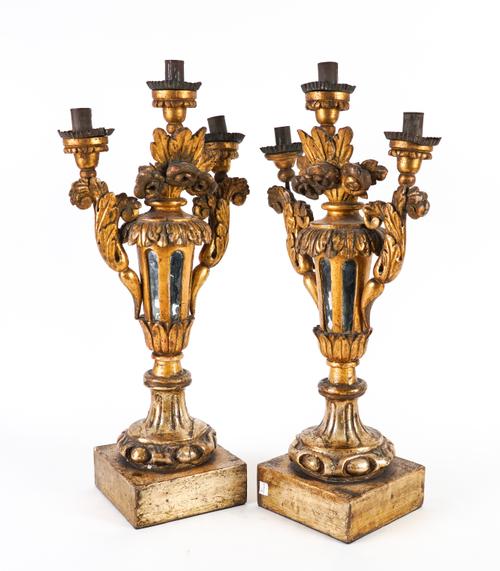 A PAIR OF ITALIAN SILVERED AND GILT WOOD THREE LIGHT CANDELABRA (2)