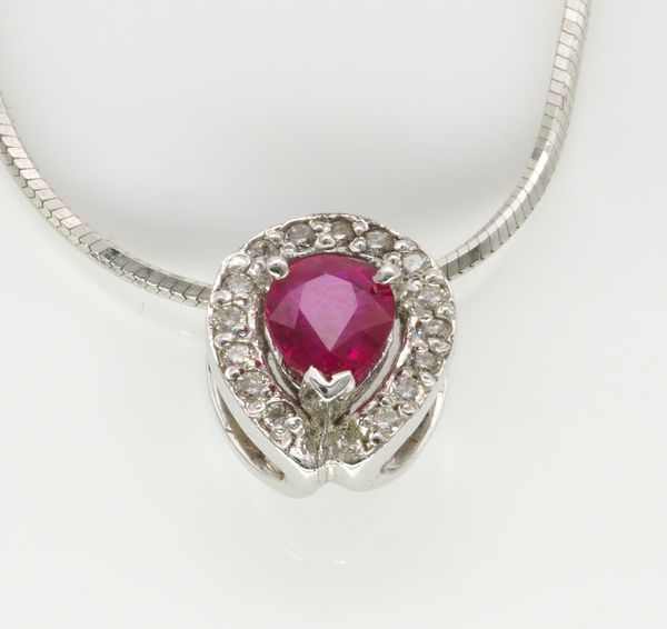 A WHITE GOLD, RUBY AND DIAMOND PENDANT WITH A WHITE GOLD NECKCHAIN