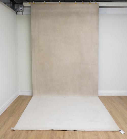 A MODERN RECTANGULAR PLAIN CREAM CARPET