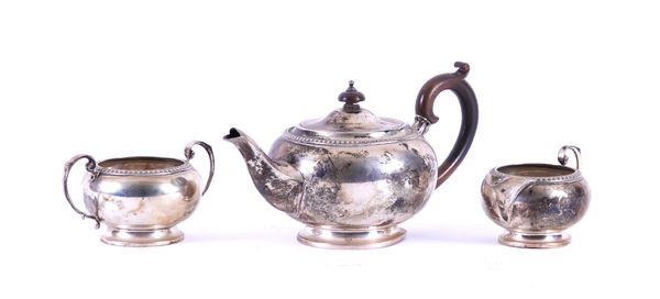 A SILVER THREE PIECE TEA SET