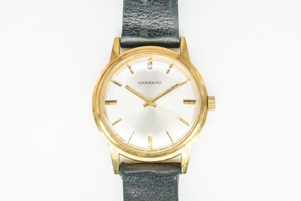 A GARRARD PRESENTATION GENTLEMAN'S GOLD WRISTWATCH