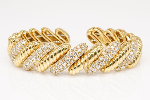 A GOLD AND DIAMOND CUFF BANGLE