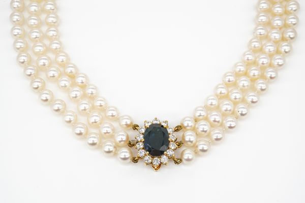 A THREE ROW NECKLACE OF UNIFORM CULTURED PEARLS