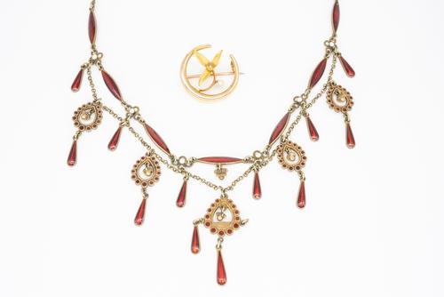 A SCANDINAVIAN SILVER GILT AND ENAMEL NECKLACE AND A GOLD AND SEED PEARL BROOCH (2)