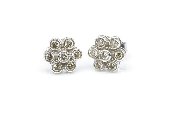 A PAIR OF WHITE GOLD AND DIAMOND SEVEN STONE CLUSTER EARSTUDS