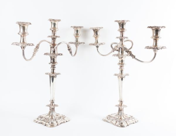 A PAIR OF PLATED THREE LIGHT TABLE CANDELABRA