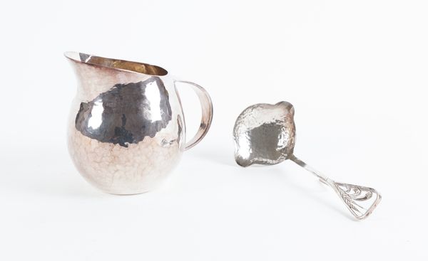 A SILVER CREAM JUG AND AN ASSOCIATED LADLE (2)