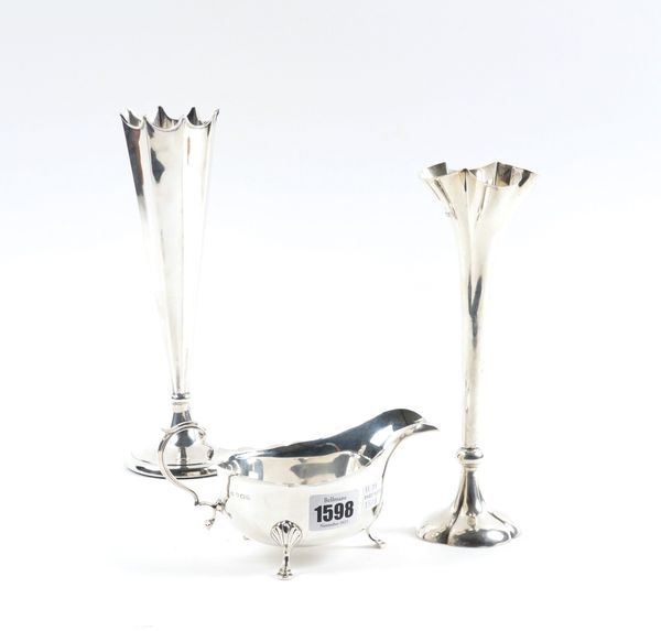 A SILVER SAUCEBOAT AND TWO SILVER VASES (3)