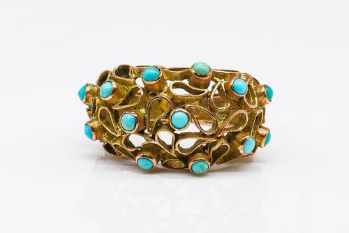 A GOLD AND TURQUOISE RING