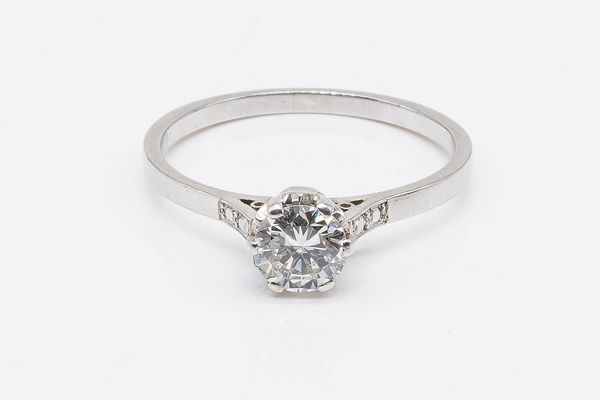 A PLATINUM AND DIAMOND SINGLE STONE RING