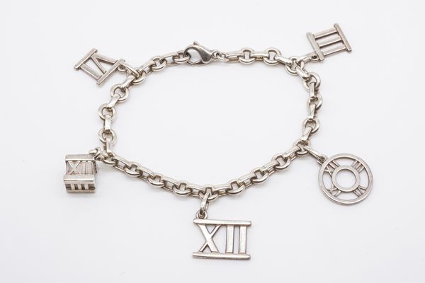 A SILVER TIFFANY AND CO CHARM BRACELET