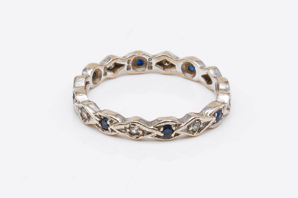 AN 18CT WHITE GOLD, SAPPHIRE AND DIAMOND ETERNITY RING