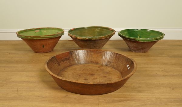 THREE LARGE GREEN LUSTRE GLAZED TERRACOTTA MIXING BOWLS AND AN ELM BOWL (4)