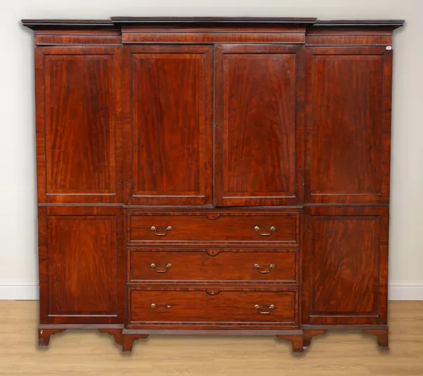 A GEORGE III MAHOGANY BREAKFRONT TRIPLE WARDROBE