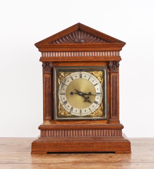 AN OAK CASED MANTLE CLOCK