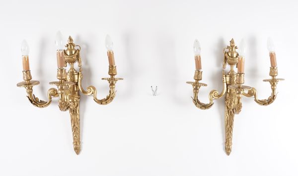 A SET OF FOUR LOUIS XVI STYLE GILT-METAL THREE LIGHT WALL APPLIQUES (4)