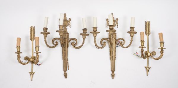 A PAIR OF EMPIRE STYLE GILT-METAL TWIN-LIGHT WALL APPLIQUES AND ANOTHER PAIR (4)