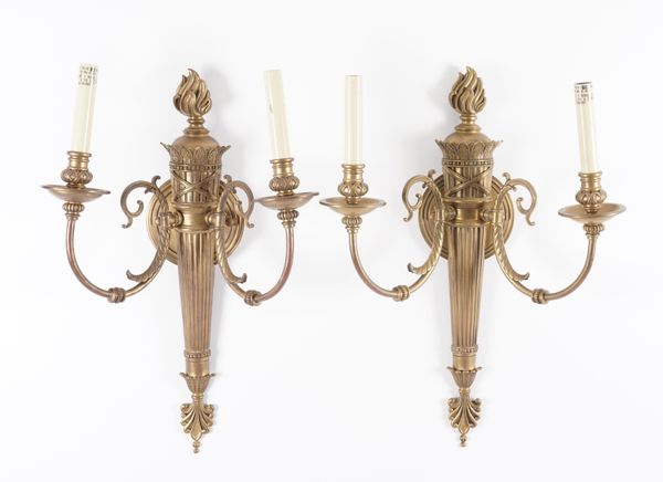 A SET OF FOUR EMPIRE STYLE GILT-METAL TWIN LIGHT WALL APPLIQUES (4)