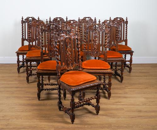 A SET OF TEN VICTORIAN CARVED OAK DINING CHAIRS (10)
