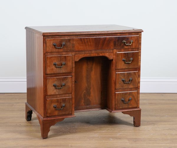 A GEORGE II STYLE MAHOGANY KNEEHOLE WRITING DESK