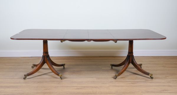 A GEORGE III STYLE MAHOGANY TWIN PEDESTAL DINING TABLE