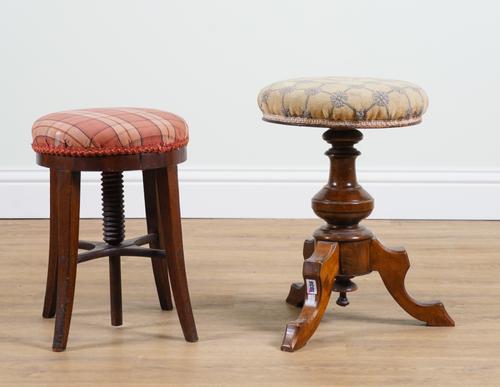 A LATE VICTORIAN WALNUT REVOLVING PIANO STOOL (2)