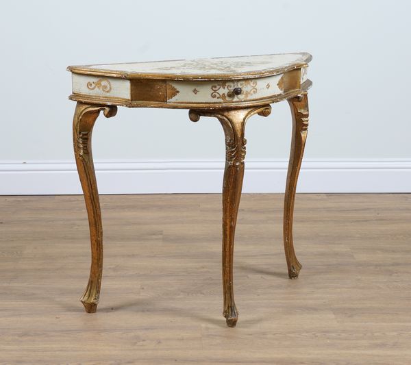 A ITALIAN  PARCEL GILT CREAM PAINTED SERPENTINE SINGLE DRAWER SIDE TABLE