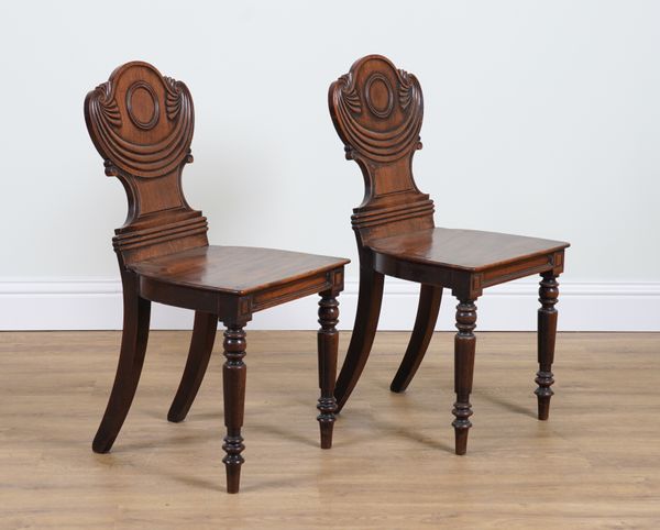 A PAIR OF REGENCY MAHOGANY HALL CHAIRS (2)