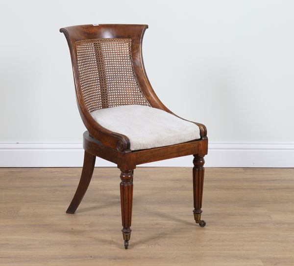 A GEORGE IV MAHOGANY AND CANEWORK  DESK CHAIR