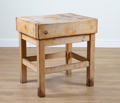 A MID 20TH CENTURY BUTCHERS BLOCK ON PINE BASE