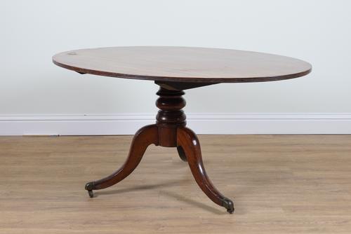A 19TH CENTURY OVAL MAHOGANY SNAP TOP CENTRE TABLE
