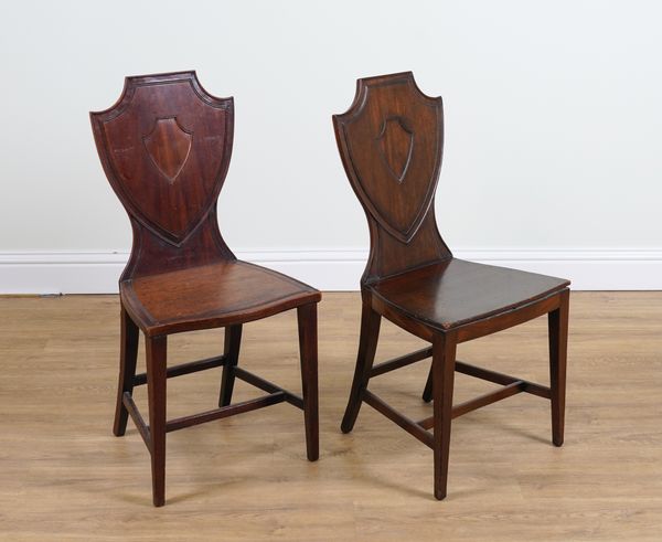 A NEAR PAIR OF 19TH CENTURY MAHOGANY SHIELD BACK HALL CHAIRS (2)