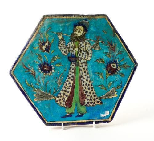 A PERSIAN HEXAGONAL POTTERY TILE