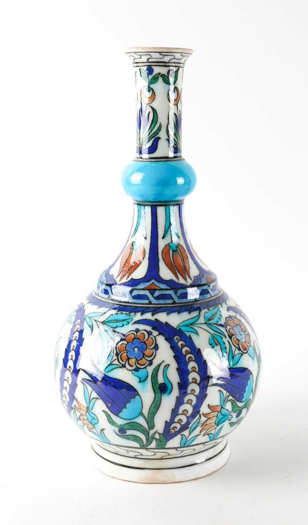 A TALL IZNIK POTTERY BOTTLE VASE