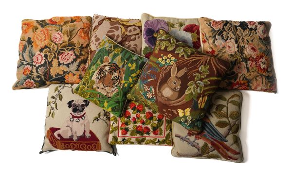 A GROUP OF TEN VARIOUS WOOL NEEDLEPOINT CUSHIONS INCLUDING TWO DEPICTING SEATED PUG DOGS (10)