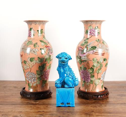 A PAIR OF CHINESE SALMON PINK GROUND BALUSTER VASES AND A TURQUOISE GLAZED BUDDHIST LION (3)
