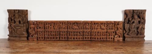 AN INDIAN CARVED WOOD FRIEZE PANEL OR ELONGATED WALL POCKET, TOGETHER WTH  A TWO SIMILAR PANELS (3)