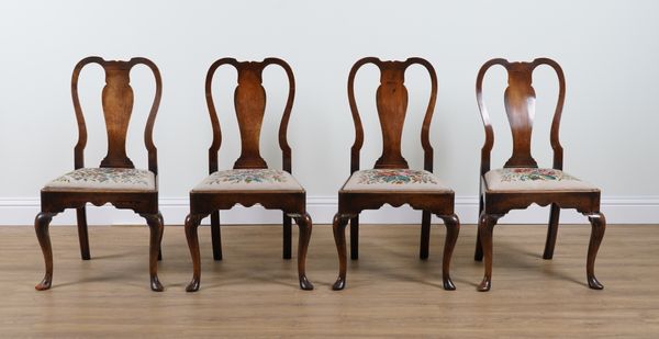 A SET OF FOUR QUEEN ANNE STYLE WALNUT FRAMED VASEBACK CHAIRS (4)