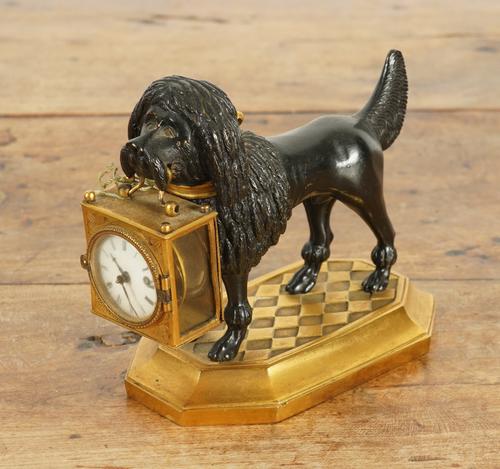 A FRENCH GILT AND PATINATED BRONZE DOG TIMEPIECE