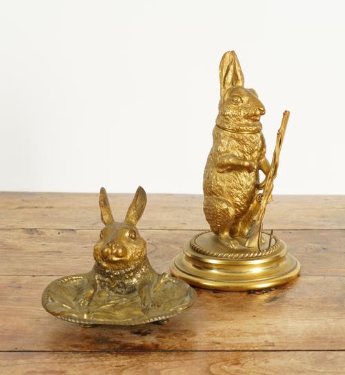 TWO VICTORIAN GILT-BRONZE NOVELTY INKWELLS IN THE FORM OF HARES (2)