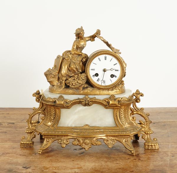 A FRENCH LOUIS XV STYLE GILT SPELTER MOUNTED ALABASTER MANTEL CLOCK